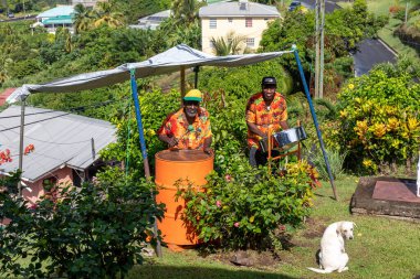 09 JAN 2020 - St George's, Grenada, West Indies - Musicians playing steel pan clipart