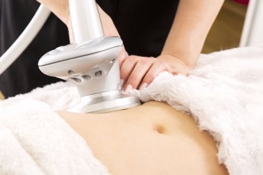 Slimming and cellulite laser treatment at clinic clipart