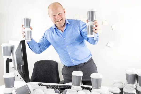 Happy businessman drinks too much coffee — Stock Photo, Image