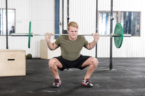 Squats training at fitness gym center — Stock Photo, Image