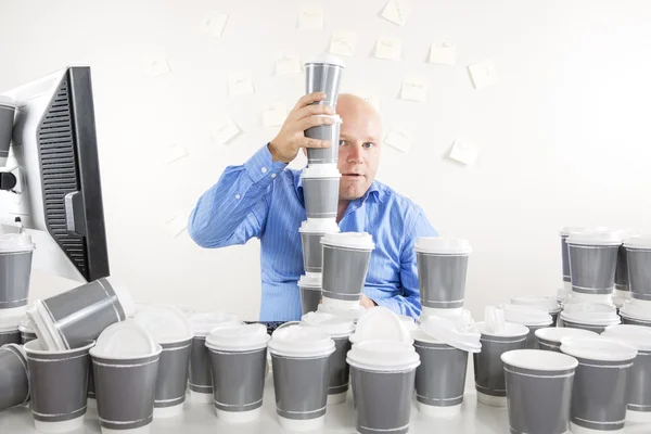 Businessman with extreme coffee addiction — Stock Photo, Image