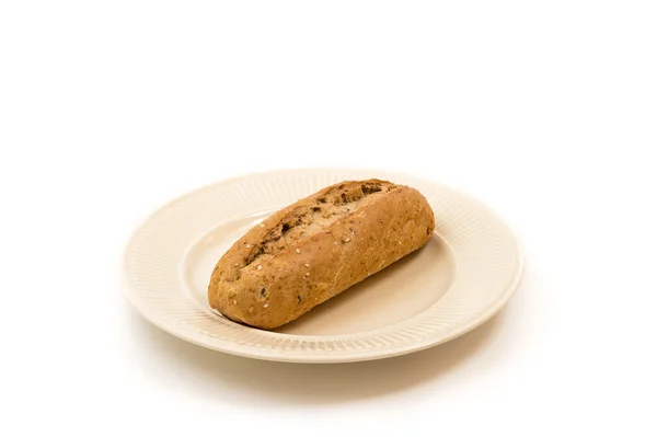 One baguette on an off-white plate — Stock Photo, Image