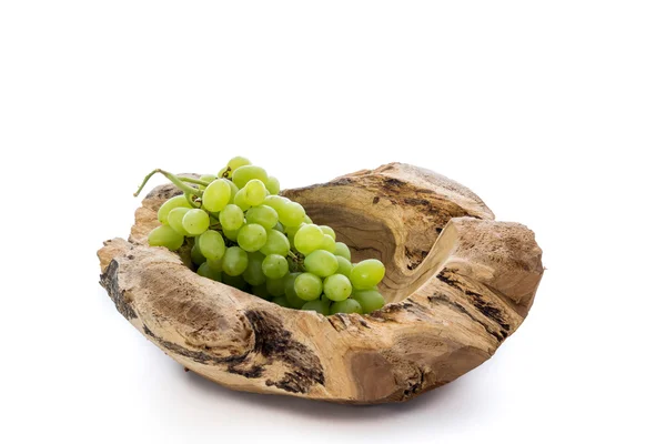 Wooden bowl with a bunch of grapes — Stock Photo, Image