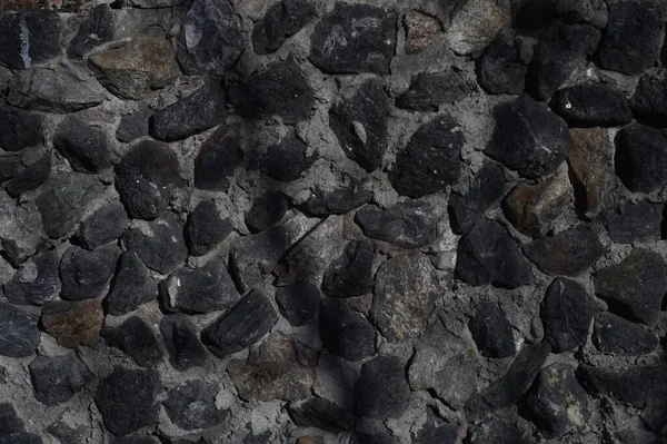 Photo Texture Black Stone Concrete Mortar Illuminated Direct Rays Sun — Stock Photo, Image