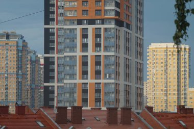 Geometric pattern. It is formed by parts of the facades of city buildings. Building materials - glass and colored plastic.