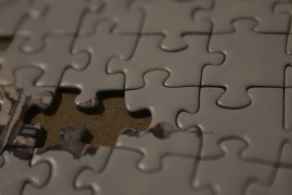 Kis darab egy puzzle, egy kihívást jelentő társasjáték. — Stock Fotó