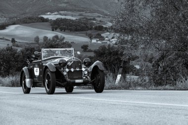 CAGLI , ITALY - OTT 24 - 2020 : ALFA ROMEO 6C 1750 SS YOUNG 1929 on an old racing car in rally Mille Miglia 2020 the famous italian historical race (1927-1957) clipart