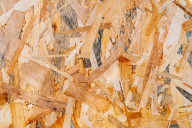 Organik ahşap arka plan. OSB materyal dokusu. Geri dönüştürülmüş sıkıştırılmış tahta yontma tahtası, kontrplak dokusu.