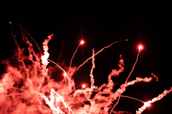 Shining Fireworks Red Smoke Fireworks Emitting Sparks Night Dark Background — Fotografia de Stock