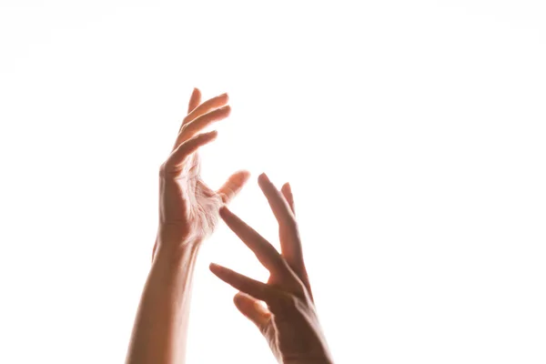 Kézmozdulatok. Az elegáns női kezek elkapnak valamit, ami felülről esik., — Stock Fotó