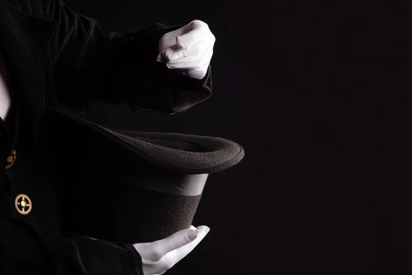 Hand gestures. Showman shows disappearing tricks in a hat, white gloves and black top hat, — Stock Photo, Image