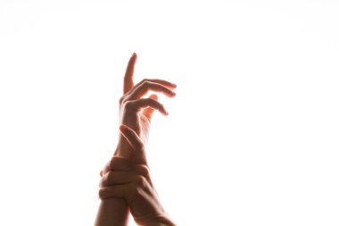 El hareketleriyle. Zarif dişi eller bir elini öne uzatır, diğeri onu durdurur.,