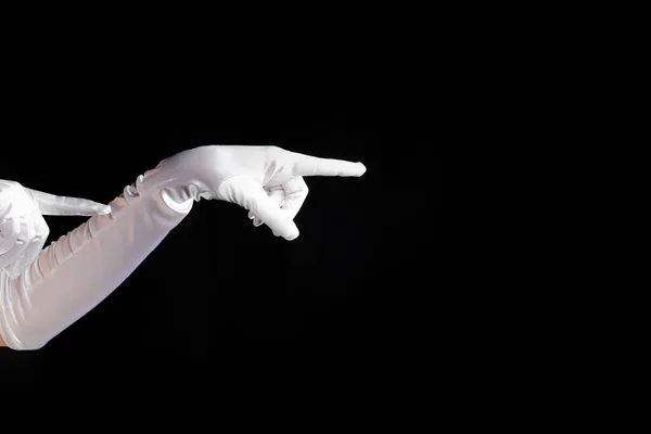 Ręczne gesty. dama w długich białych rękawiczkach wskazuje na bok, pokaz magii. — Zdjęcie stockowe