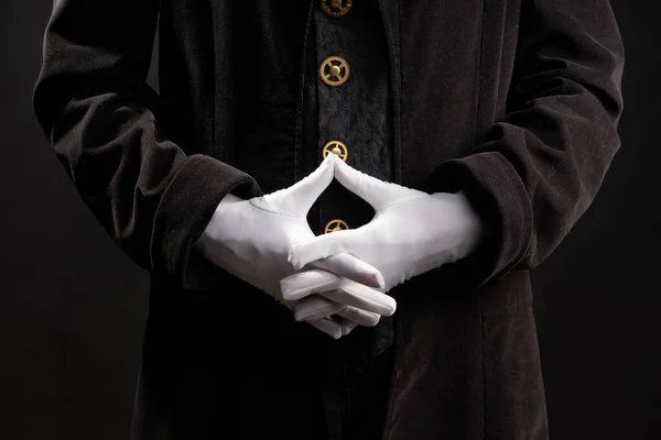 Handgester. Showman eller magiker illusionist i vita handskar på en svart bakgrund. — Stockfoto