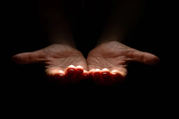 Two hands with open palms turned up, offering or giving something, a handful. — Stock Photo, Image