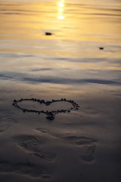 Hand drawn heart in sand beach,sunset time — Stock Photo, Image