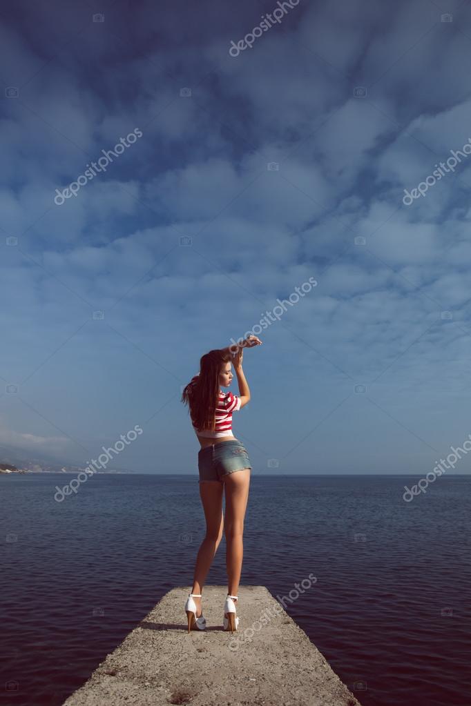Pin Up Young Beautiful Girl On The Sea In Short Jeans And Striped