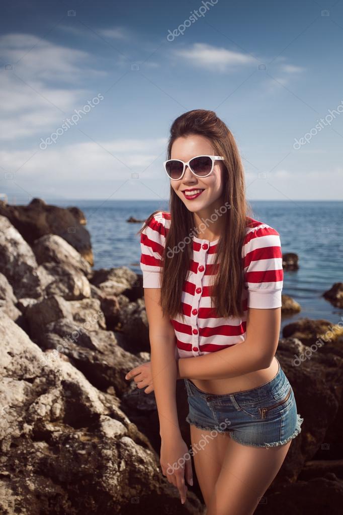 Pin Up Young Beautiful Girl On The Sea In Short Jeans And Striped