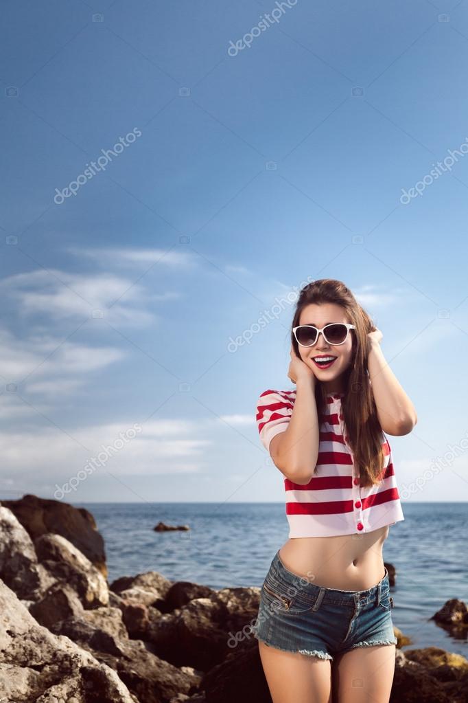 Pin Up Young Beautiful Girl On The Sea In Short Jeans And Striped