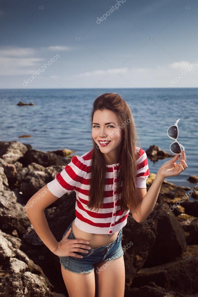 Pin Up Young Beautiful Girl On The Sea In Short Jeans And Striped