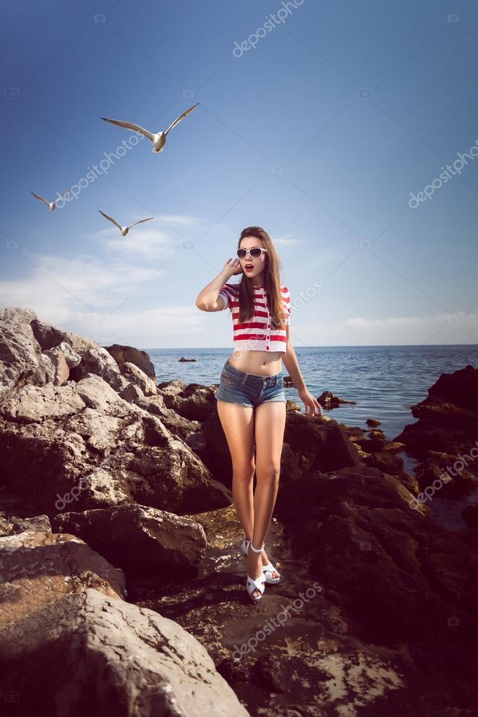 Pin Up Young Beautiful Girl On The Sea In Short Jeans And Striped