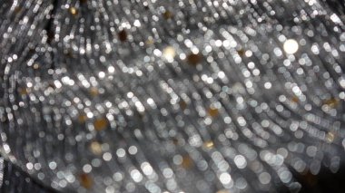Gümüş ve altınla özetlenmiş soyut bokeh