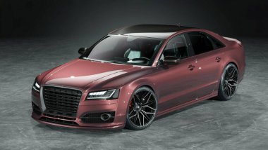 Parlak kırmızı kaplamalı lüks bir sedan..