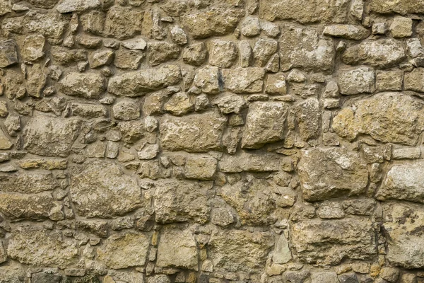 The wall of sandstone blocks of different surfaces. — Stock Photo, Image