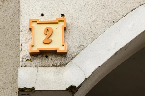 Number on the wall of the house, number two. — Stock Photo, Image