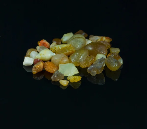 Semi-precious stones on black background — Stock Photo, Image