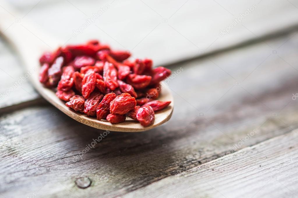 Goji berries on wooden background