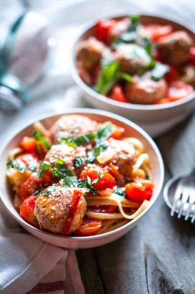 Pasta with meatballs on rustic background — Stock Photo, Image