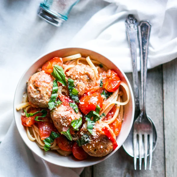 Pasta with meatballs on rustic background — Stock Photo, Image