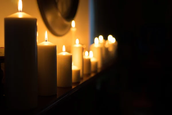 Candles on the fireplace — Stock Photo, Image