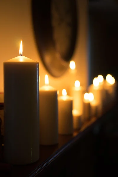 Candles on the fireplace — Stock Photo, Image