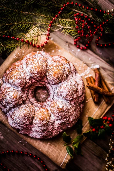 Christmas cake on wooden background — Stock Photo, Image