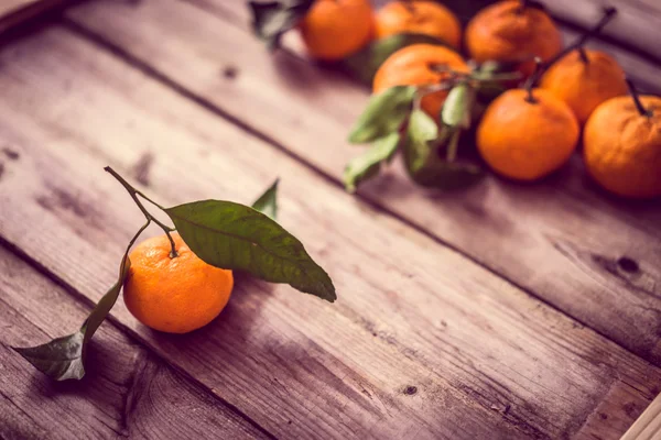 Tangerines on rustic background — Stock Photo, Image