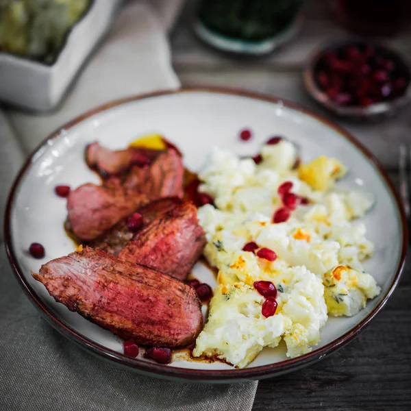 Grilled steak with cauliflower and pomegranate — Stock Photo, Image