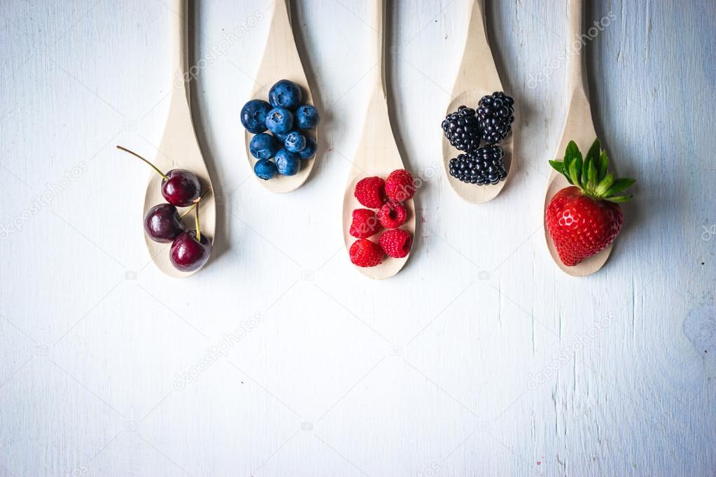 Berries on wooden rustic background