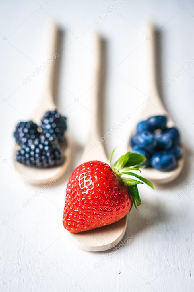 Berries on wooden rustic background