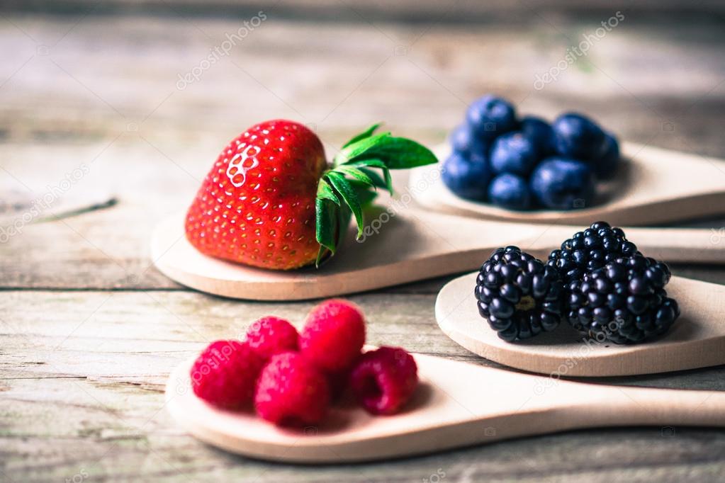 Berries on wooden rustic background