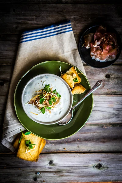 Cream soup with bread and meat on wooden background — Stock Image Cream soup with bread and meat on wooden background Stock Image