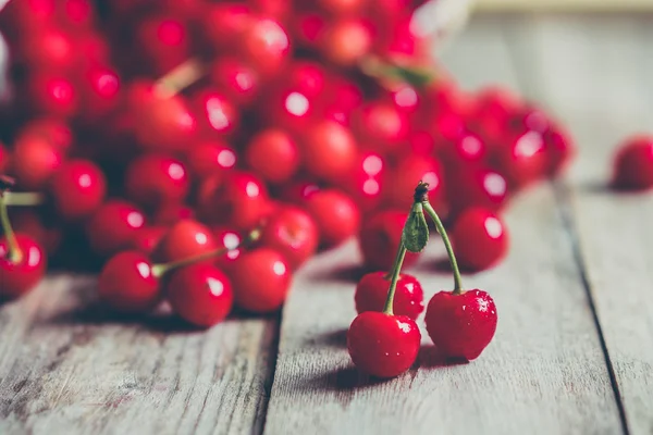 Cherries on wooden background — Stock Photo, Image