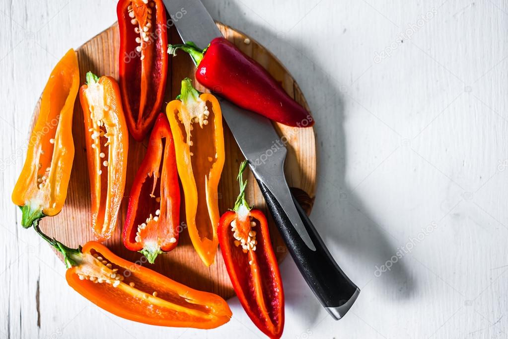 Colorful peppers on rustic background