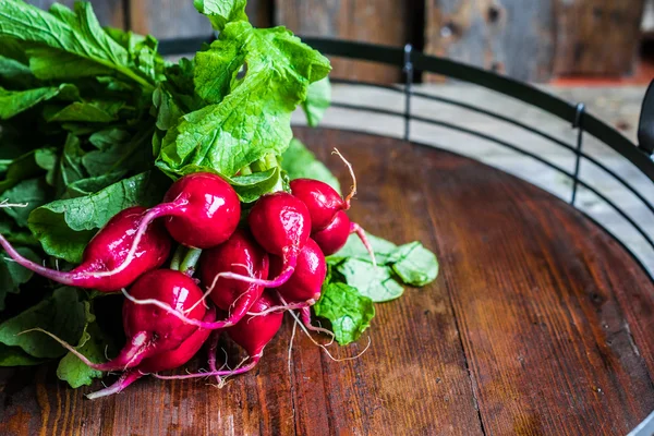 Radishes on wooden background — Stock Photo, Image