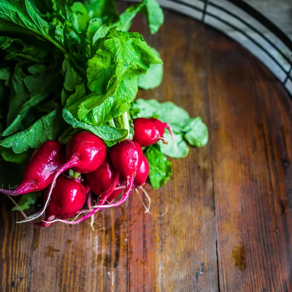 Radishes on wooden background — Stock Photo, Image