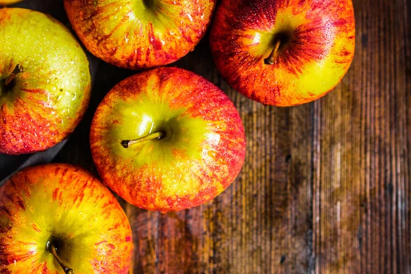 Colorful apples on wooden background — Stock Photo, Image
