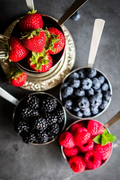 Mix of fresh berries on rustic background — Stock Photo, Image