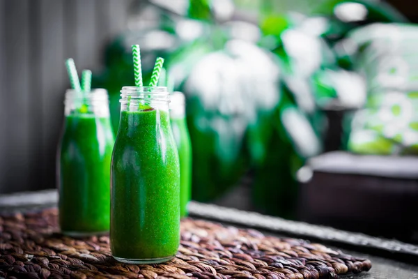 Fresh green smoothie outdoors