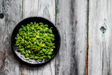 Rustik arka plan üzerinde kabak çekirdeği